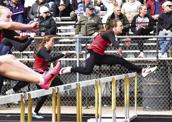 Sailing ... Boone Central’s Avery Krohn glides through the hurdles in the Northwest Dave Gee Invite at Grand Island April 18. Krohn placed third in the 100 meter hurdles with a personal best time of 16.46. (Photo, Nolan Vandenberg, Boone Central Schools)